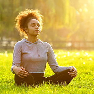 Woman meditating in nature