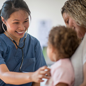 Little girl at a check-up with her mother