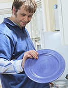 Young man doing dishes
